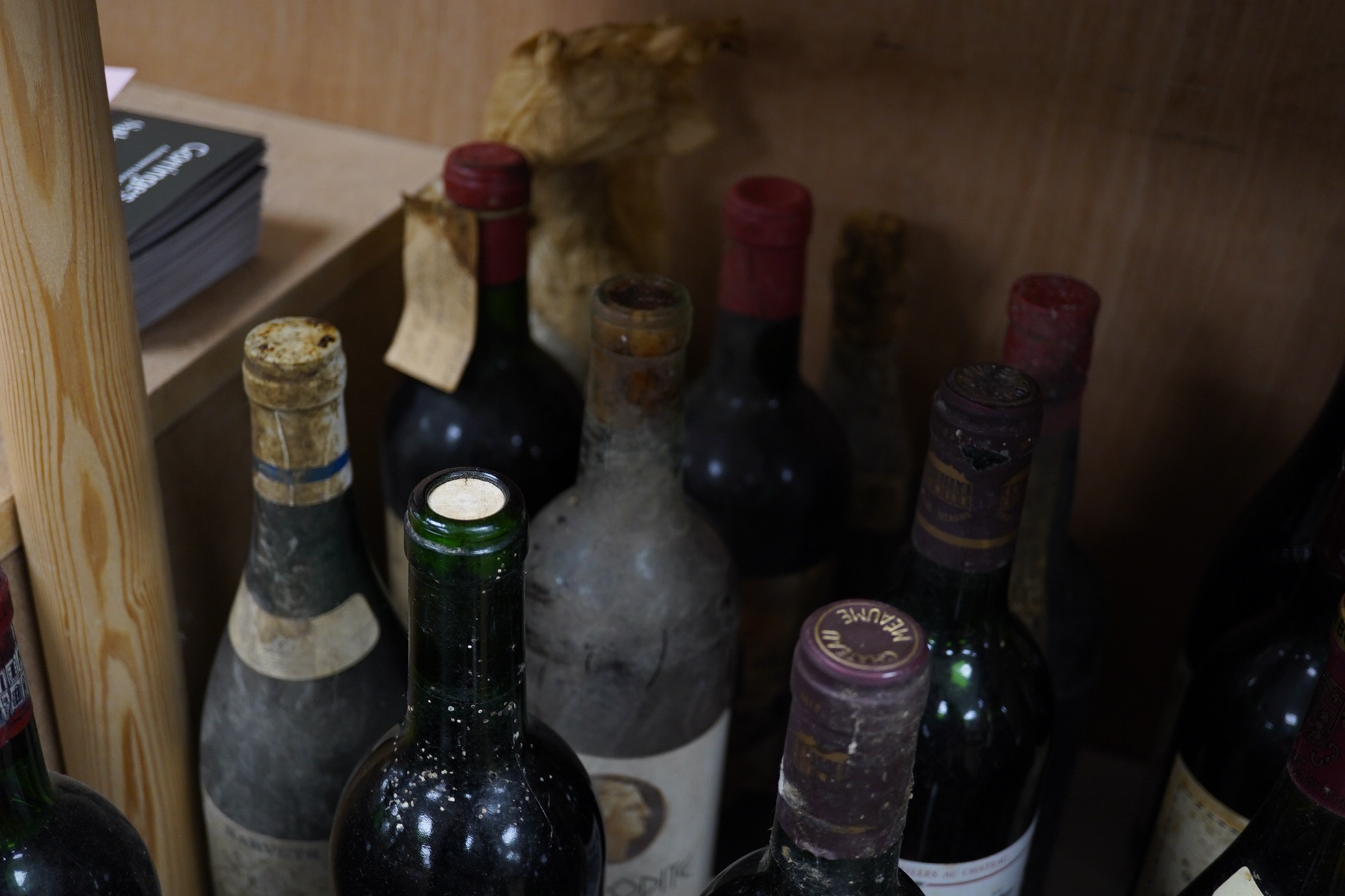 Twenty-five bottles and half bottles of wine, including; four bottles of Chateau Meaume 1986 Bordeaux Superior, a bottle of 1982 Chateau Montbrun Margaux, a Harveys Bourgogne Aligote 1970, etc. Condition - poor to fair